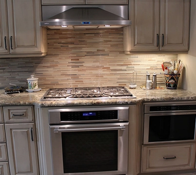Modern Kitchen with Stainless Steel Appliances and Tile Backsplash